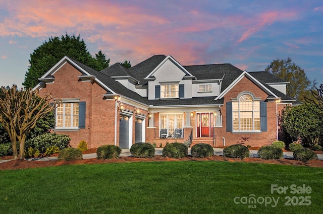 1404 Churchill Downs Dr, Waxhaw, NC 28173 - traditional home featuring a lawn, roof with shingles, and brick siding