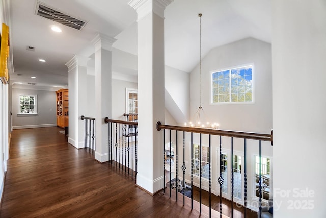 1404 Churchill Downs Dr, Waxhaw, NC 28173 - hall featuring a notable chandelier, an upstairs landing, wood finished floors, ornate columns, and visible vents