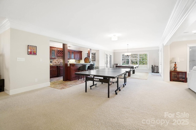 1404 Churchill Downs Dr, Waxhaw, NC 28173 - rec room featuring crown molding, baseboards, and light carpet