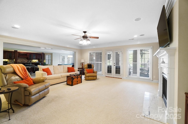1404 Churchill Downs Dr, Waxhaw, NC 28173 - carpeted living room featuring a fireplace with flush hearth, ornamental molding, recessed lighting, and ceiling fan