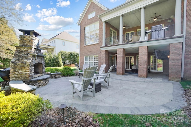 1404 Churchill Downs Dr, Waxhaw, NC 28173 - view of patio / terrace with a ceiling fan, a fireplace, and a balcony