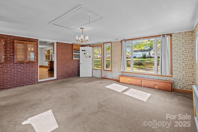 unfurnished sunroom featuring a chandelier