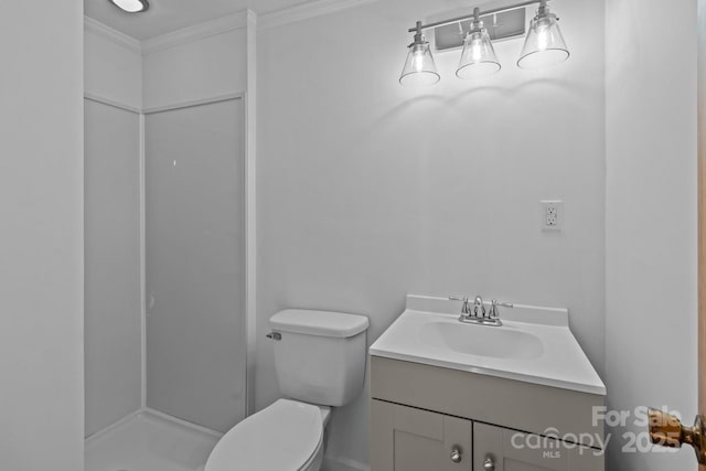 full bath with ornamental molding, toilet, a shower stall, and vanity
