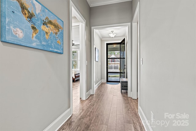 8718 Festival Way, Charlotte, NC 28215 - hallway featuring ornamental molding, baseboards, and wood finished floors