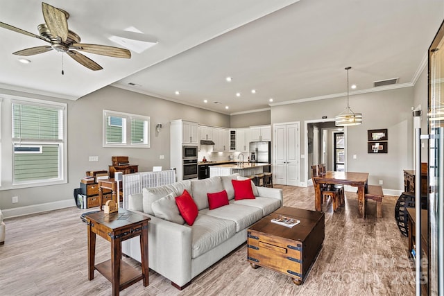 8718 Festival Way, Charlotte, NC 28215 - living area featuring crown molding, ceiling fan, baseboards, and recessed lighting