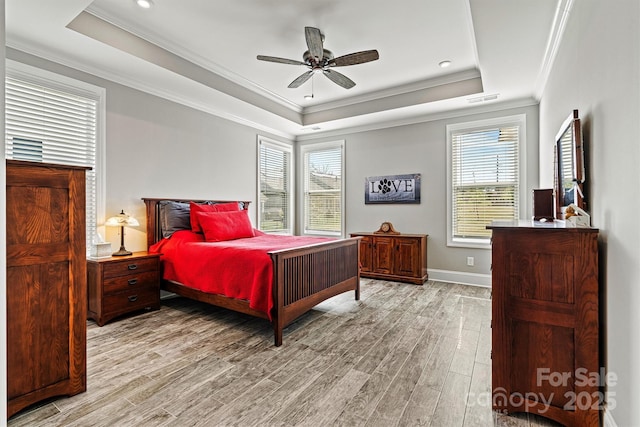 8718 Festival Way, Charlotte, NC 28215 - bedroom featuring a tray ceiling, light wood-style floors, ornamental molding, and visible vents
