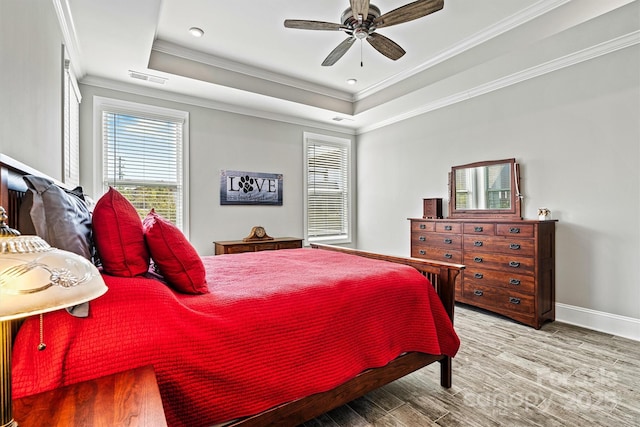 8718 Festival Way, Charlotte, NC 28215 - bedroom featuring a raised ceiling, crown molding, multiple windows, and visible vents