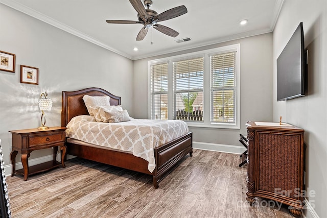 8718 Festival Way, Charlotte, NC 28215 - bedroom featuring baseboards, ornamental molding, recessed lighting, visible vents, and wood finished floors