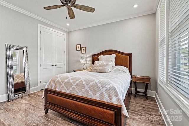 8718 Festival Way, Charlotte, NC 28215 - bedroom featuring multiple windows, baseboards, crown molding, and wood finished floors