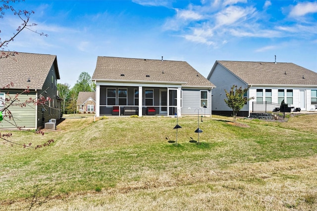 8718 Festival Way, Charlotte, NC 28215 - back of house with a yard, roof with shingles, and a sunroom