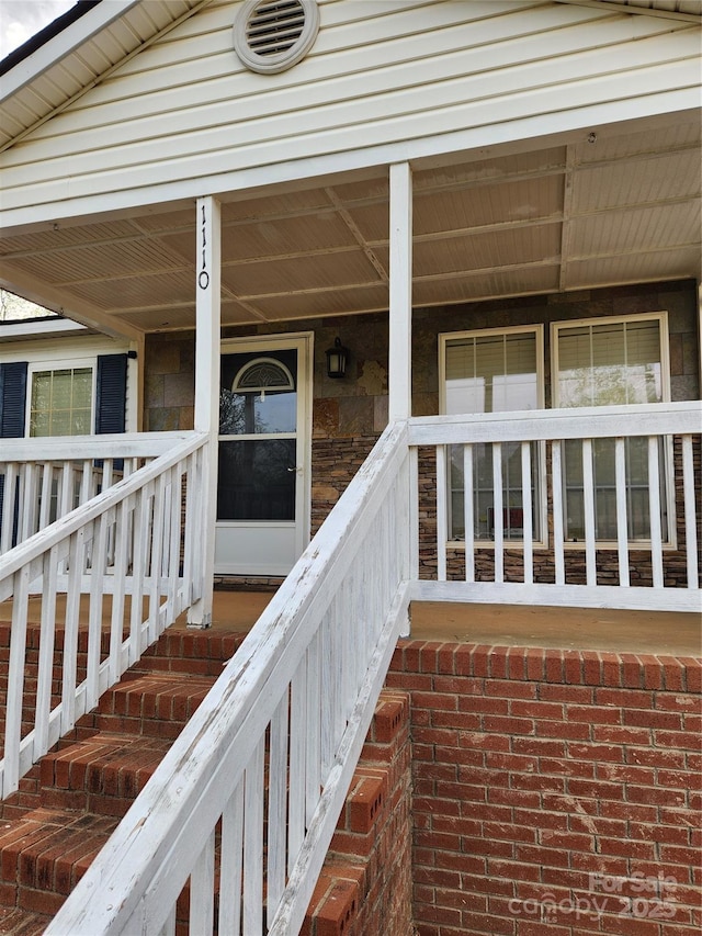 1110 Hollyberry Ln, Salisbury, NC 28147 - doorway to property featuring brick siding and covered porch