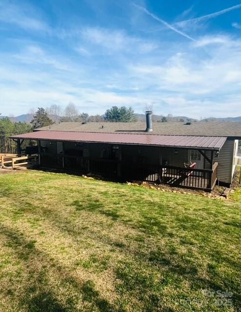 5061 Windy Woods Rd, Morganton, NC 28655 - rear view of property with a lawn and metal roof