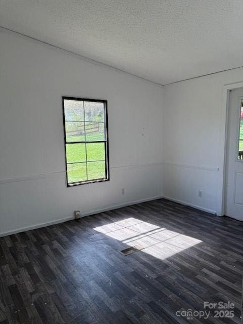 5061 Windy Woods Rd, Morganton, NC 28655 - spare room featuring a textured ceiling and dark wood finished floors