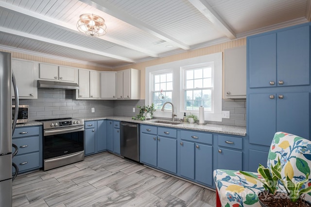 kitchen featuring blue cabinetry, under cabinet range hood, beamed ceiling, stainless steel appliances, and a sink