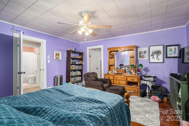 bedroom featuring a ceiling fan and wood finished floors