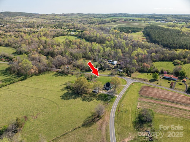 drone / aerial view with a rural view and a forest view