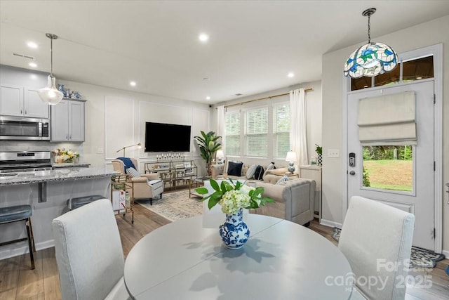 1354 Galloway Rd, Charlotte, NC 28262 - dining space featuring baseboards, recessed lighting, and wood finished floors