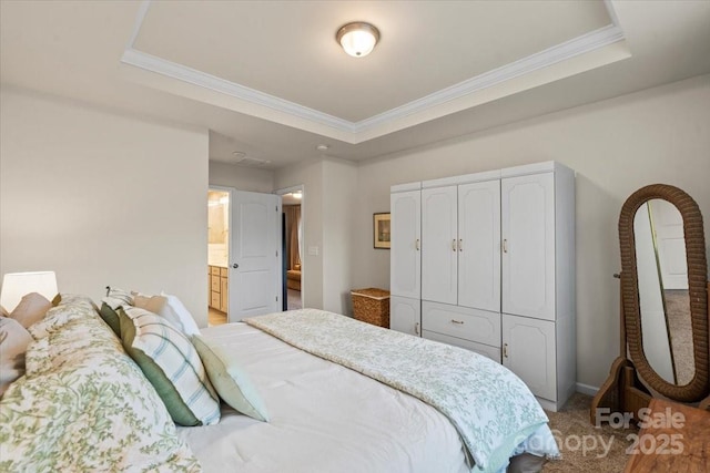 1354 Galloway Rd, Charlotte, NC 28262 - bedroom featuring a tray ceiling, connected bathroom, ornamental molding, and carpet floors