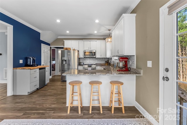 1294 Saylor Way, Nebo, NC 28761 - kitchen with tasteful backsplash, a sink, a peninsula, crown molding, and stainless steel appliances