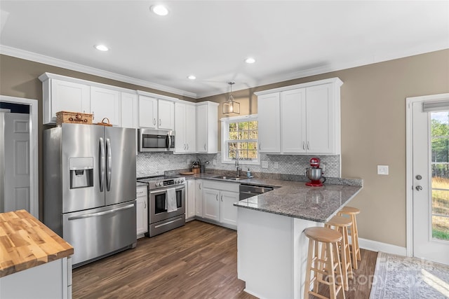1294 Saylor Way, Nebo, NC 28761 - kitchen with a sink, backsplash, a peninsula, and stainless steel appliances