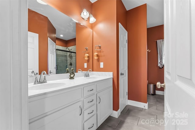 1294 Saylor Way, Nebo, NC 28761 - full bath with tile patterned flooring, a sink, a stall shower, double vanity, and baseboards