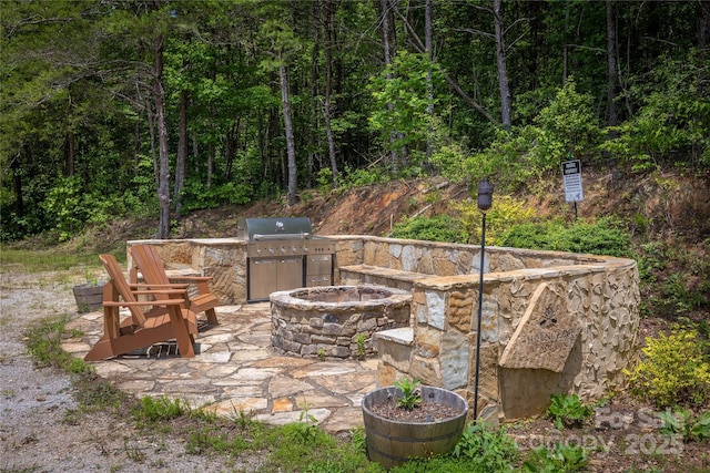 1294 Saylor Way, Nebo, NC 28761 - view of patio / terrace featuring a grill, area for grilling, a forest view, and a fire pit
