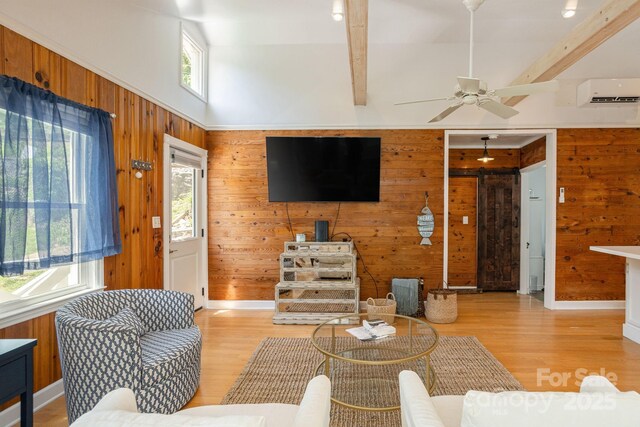 386 Charlotte Dr, Lake Lure, NC 28746 - living area featuring wooden walls, ceiling fan, light wood-style flooring, and a wealth of natural light