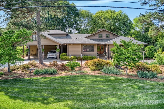 10315 Washam Potts Rd, Cornelius, NC 28031 - view of front of home with a shingled roof, a front yard, and a carport
