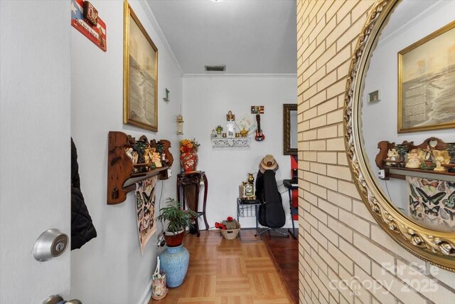 hall featuring ornamental molding