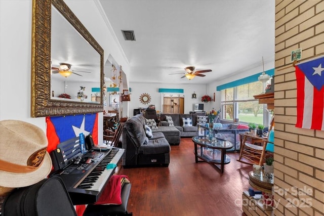 living area featuring ceiling fan, wood finished floors, and ornamental molding