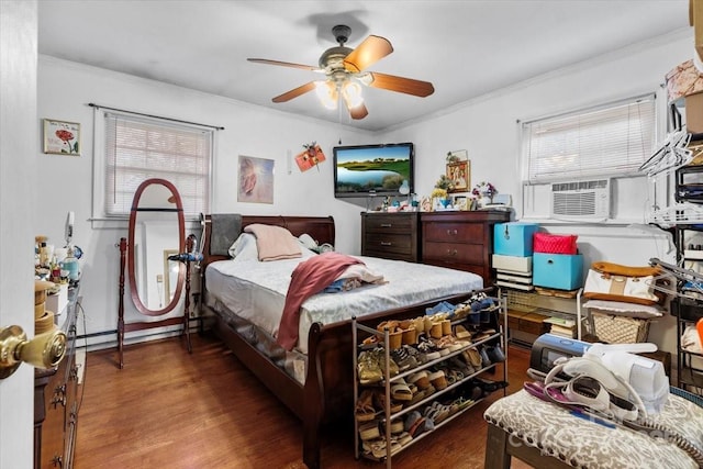 bedroom featuring wood finished floors, cooling unit, crown molding, and a ceiling fan