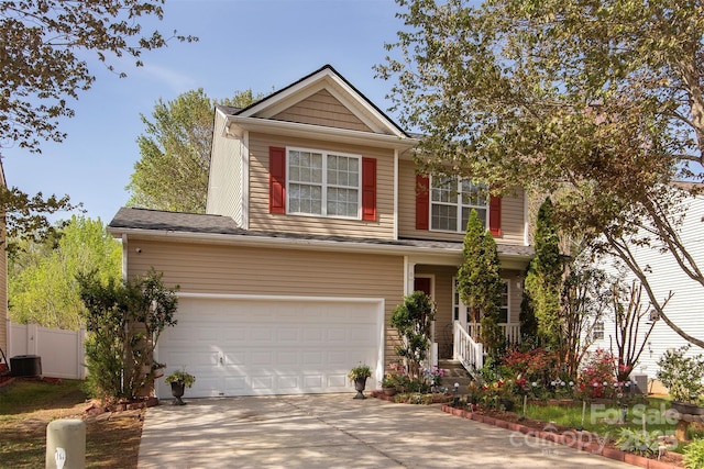 5127 Fernhill Dr, Charlotte, NC 28217 - traditional-style house with an attached garage, driveway, fence, and central AC unit