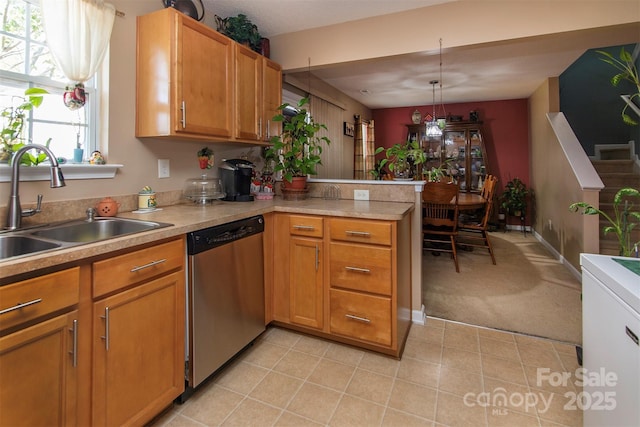 5127 Fernhill Dr, Charlotte, NC 28217 - kitchen with a peninsula, dishwasher, light countertops, and a sink