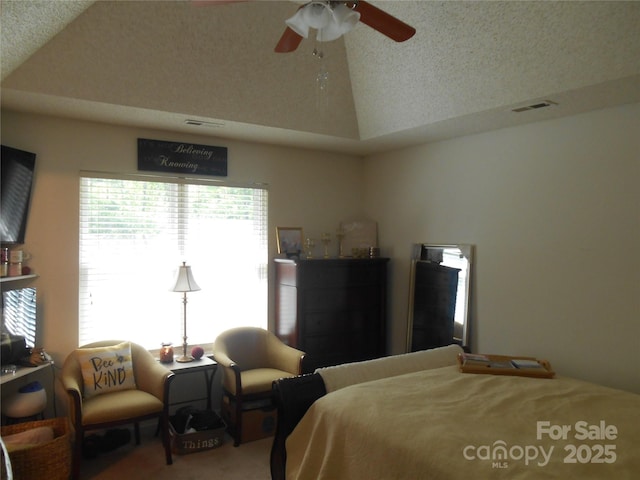 bedroom featuring carpet, visible vents, vaulted ceiling, and a ceiling fan
