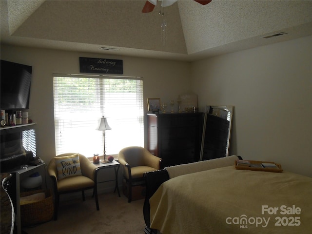bedroom featuring ceiling fan, lofted ceiling, carpet, and visible vents