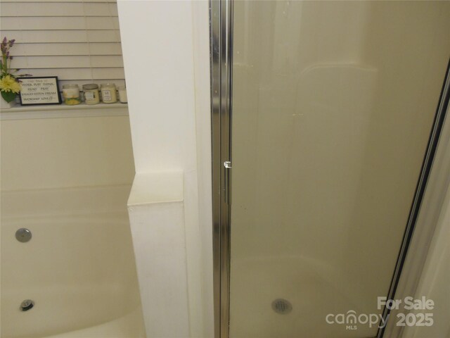 bathroom featuring a stall shower