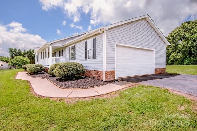 2811 Saint James Church Rd, Denver, NC 28037 - view of property exterior with a yard, brick siding, driveway, and an attached garage