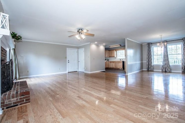 2811 Saint James Church Rd, Denver, NC 28037 - unfurnished living room with baseboards, a brick fireplace, ornamental molding, ceiling fan, and light wood-style floors