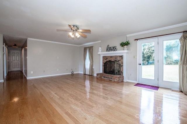 2811 Saint James Church Rd, Denver, NC 28037 - unfurnished living room with a ceiling fan, light wood-style flooring, a fireplace, baseboards, and ornamental molding