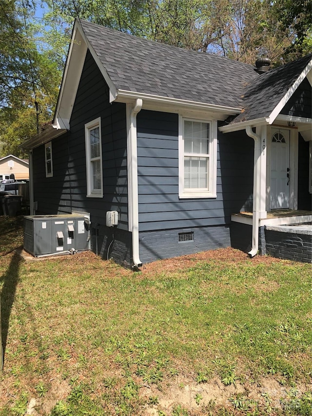401 Plymouth St, Kannapolis, NC 28083 - view of property exterior with a shingled roof, crawl space, cooling unit, and a lawn
