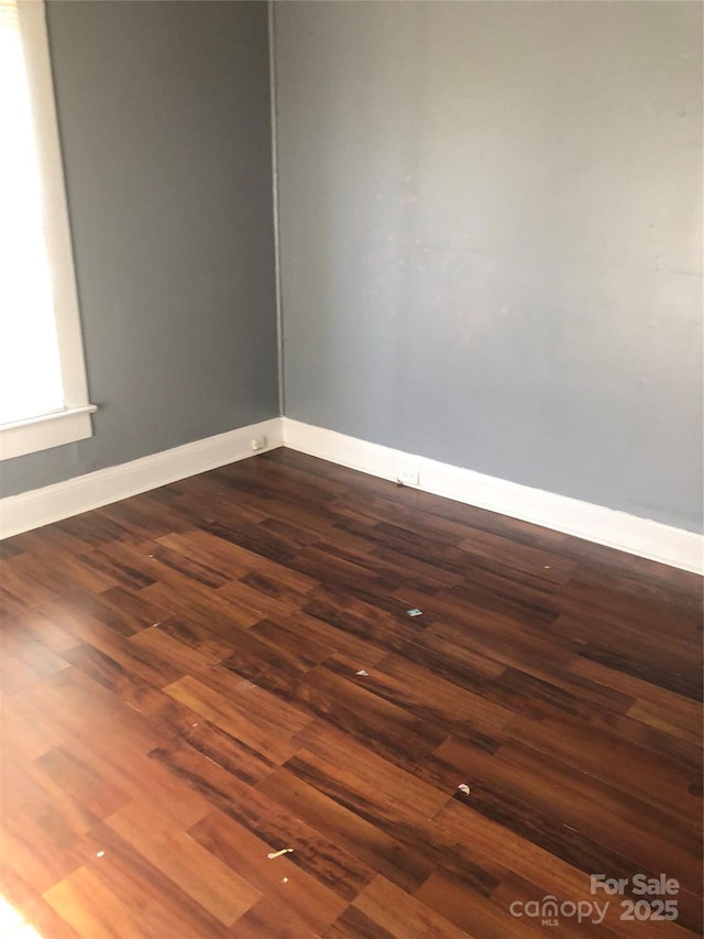 401 Plymouth St, Kannapolis, NC 28083 - spare room with dark wood-type flooring and baseboards