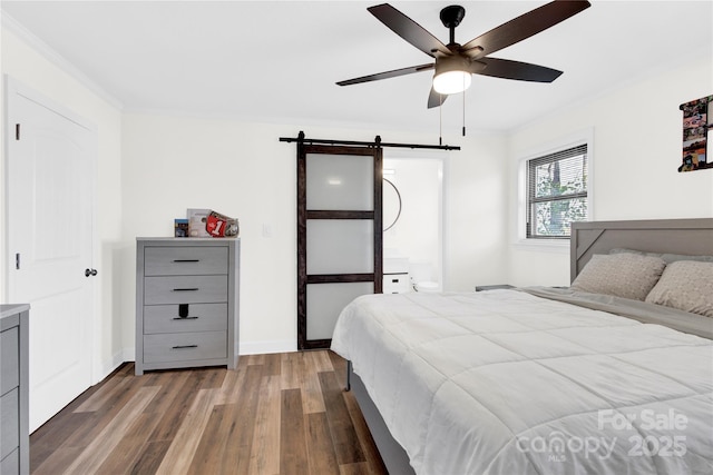 403 Greenbriar Rd S, Statesville, NC 28625 - bedroom with ceiling fan, ornamental molding, a barn door, wood finished floors, and baseboards