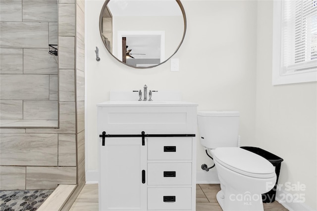 403 Greenbriar Rd S, Statesville, NC 28625 - full bathroom featuring tiled shower, vanity, a ceiling fan, and toilet