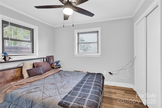 403 Greenbriar Rd S, Statesville, NC 28625 - bedroom with a closet, a ceiling fan, ornamental molding, wood finished floors, and baseboards