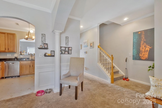 sitting room featuring light carpet, ornamental molding, and stairs