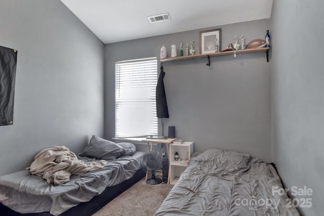 bedroom with carpet flooring and visible vents