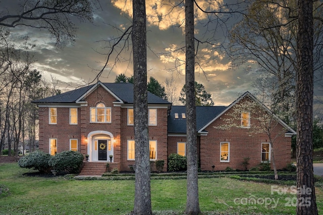 5750 Hemby Rd, Matthews, NC 28104 - view of front of home with brick siding and a lawn