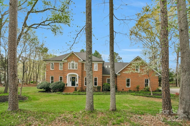 5750 Hemby Rd, Matthews, NC 28104 - view of front of property with brick siding and a front yard