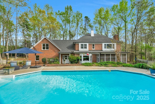 5750 Hemby Rd, Matthews, NC 28104 - pool featuring a sunroom, a patio area, and fence