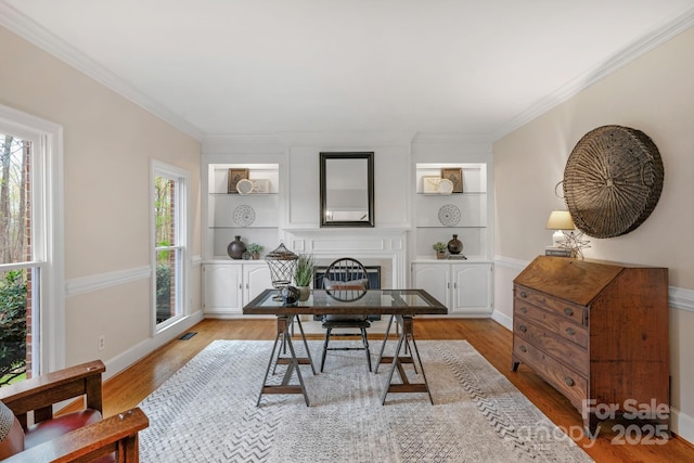 5750 Hemby Rd, Matthews, NC 28104 - office space featuring visible vents, a fireplace, built in shelves, baseboards, and light wood finished floors